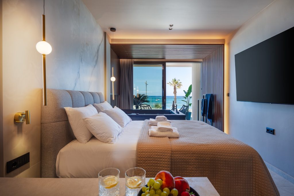 A bedroom with a view towards the coast