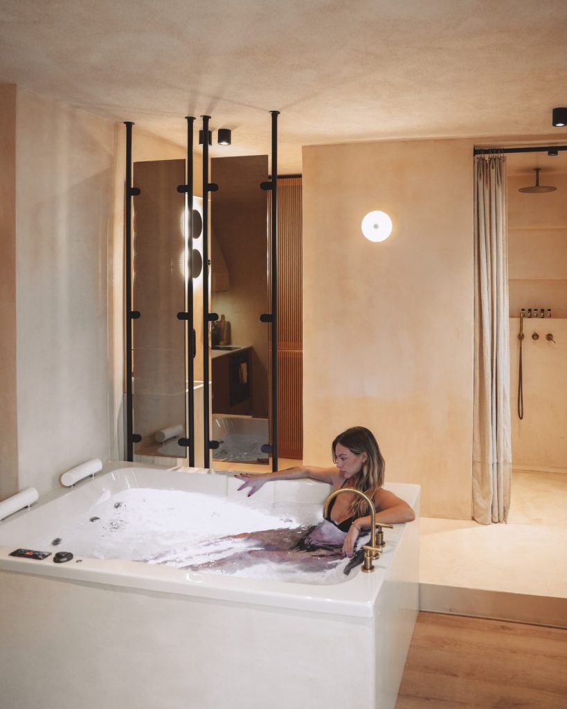 Unwind in the private jacuzzi at the Elegant suite